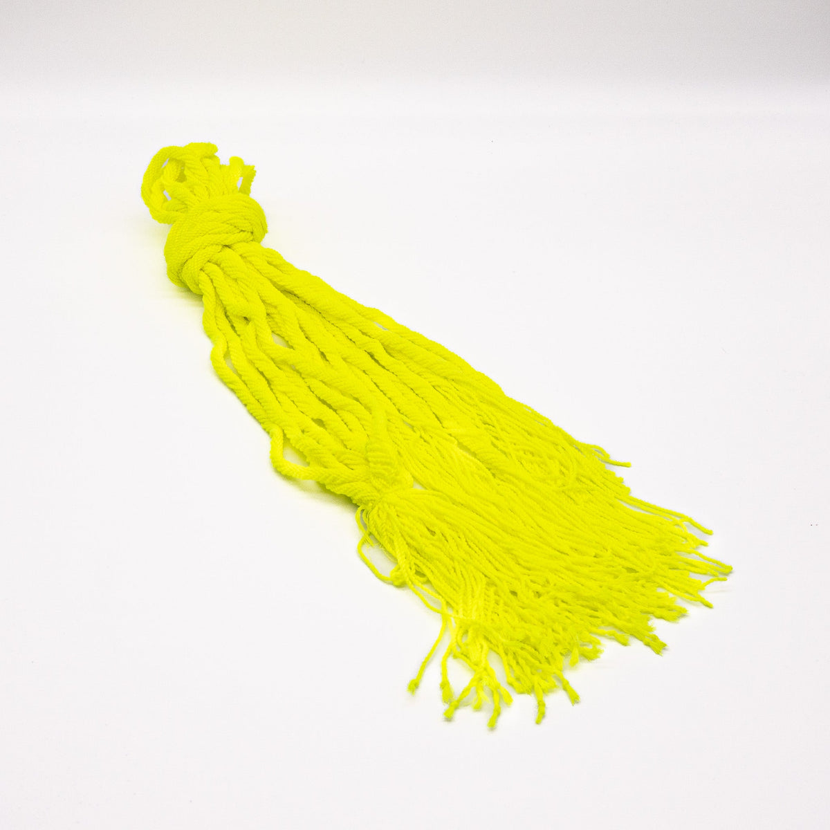 Bundle of neon yellow OFFSET Professional Yoyo String on a white background