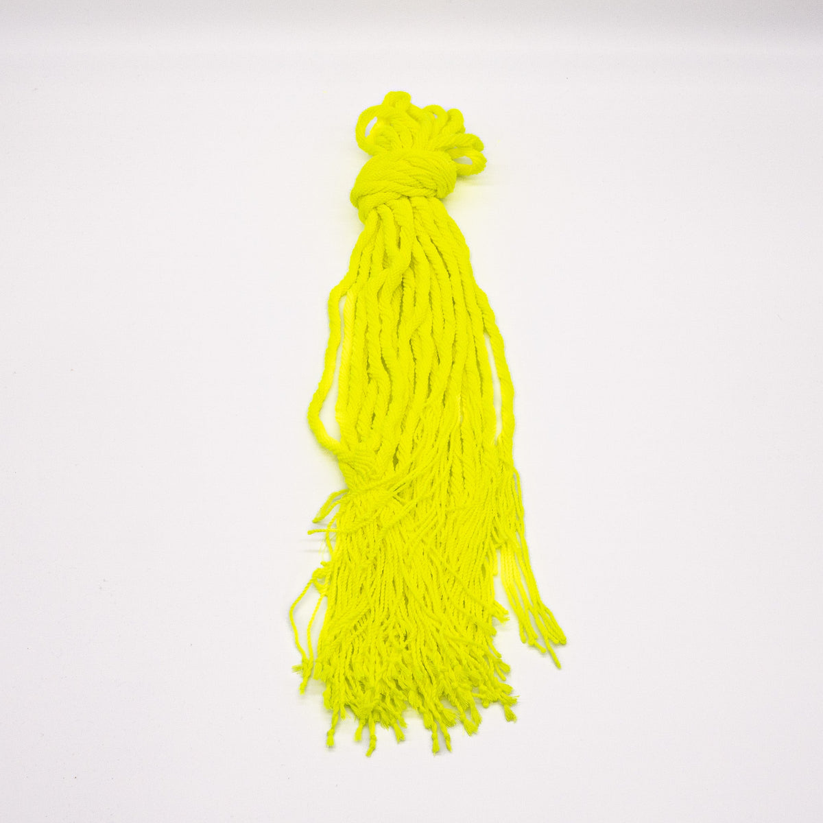 Hank of neon yellow OFFSET Professional Yoyo String hanging from its loop