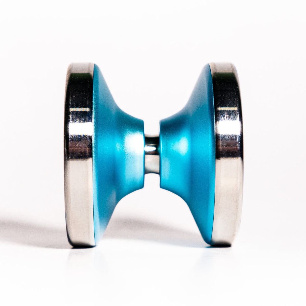 Bimetal Ascent yoyo in Aqua from the side, showing the stainless steel rims