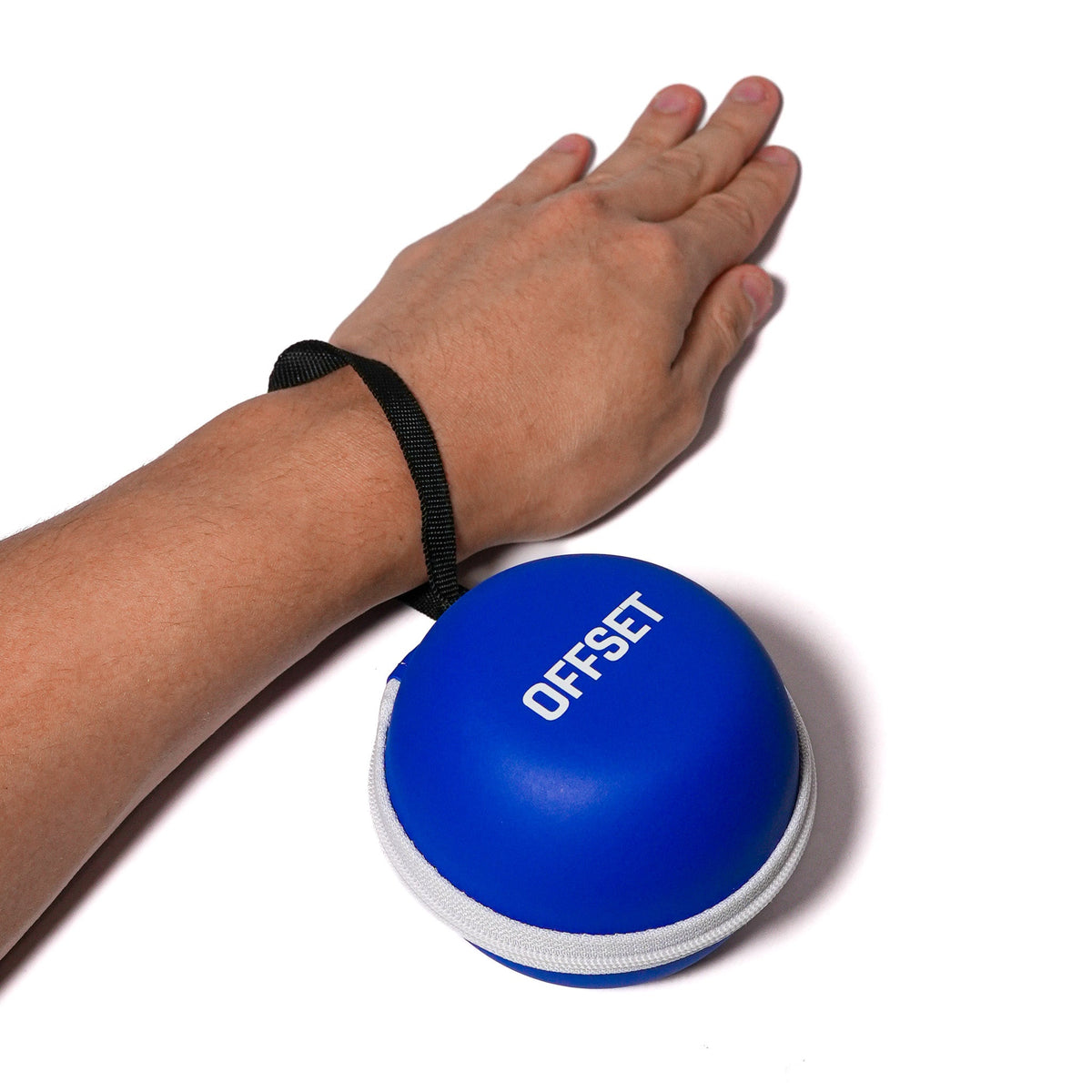Blue OFFSET Small Hard Case strapped to the wrist for everyday carry