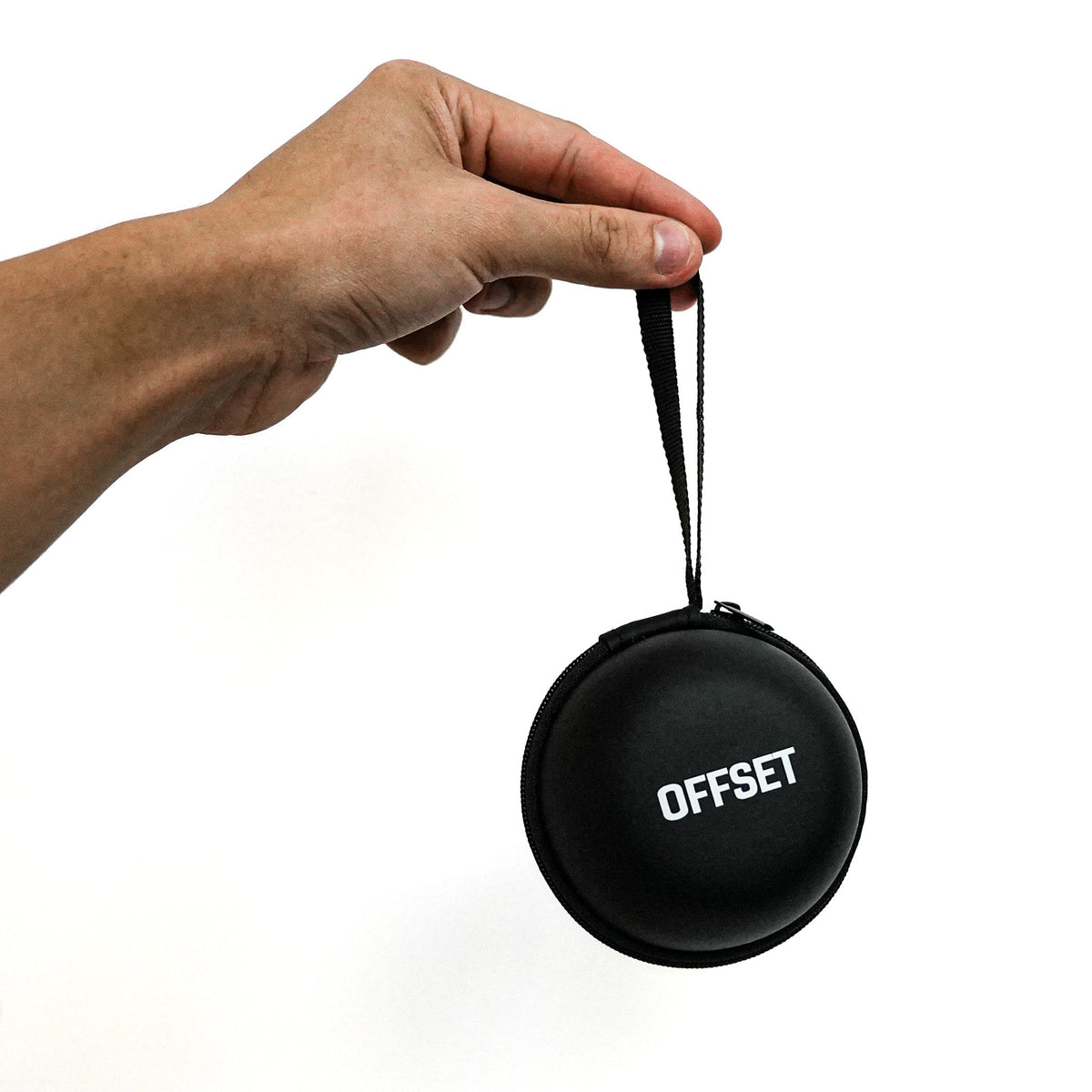 Black OFFSET Small Hard Case hanging from its wrist strap