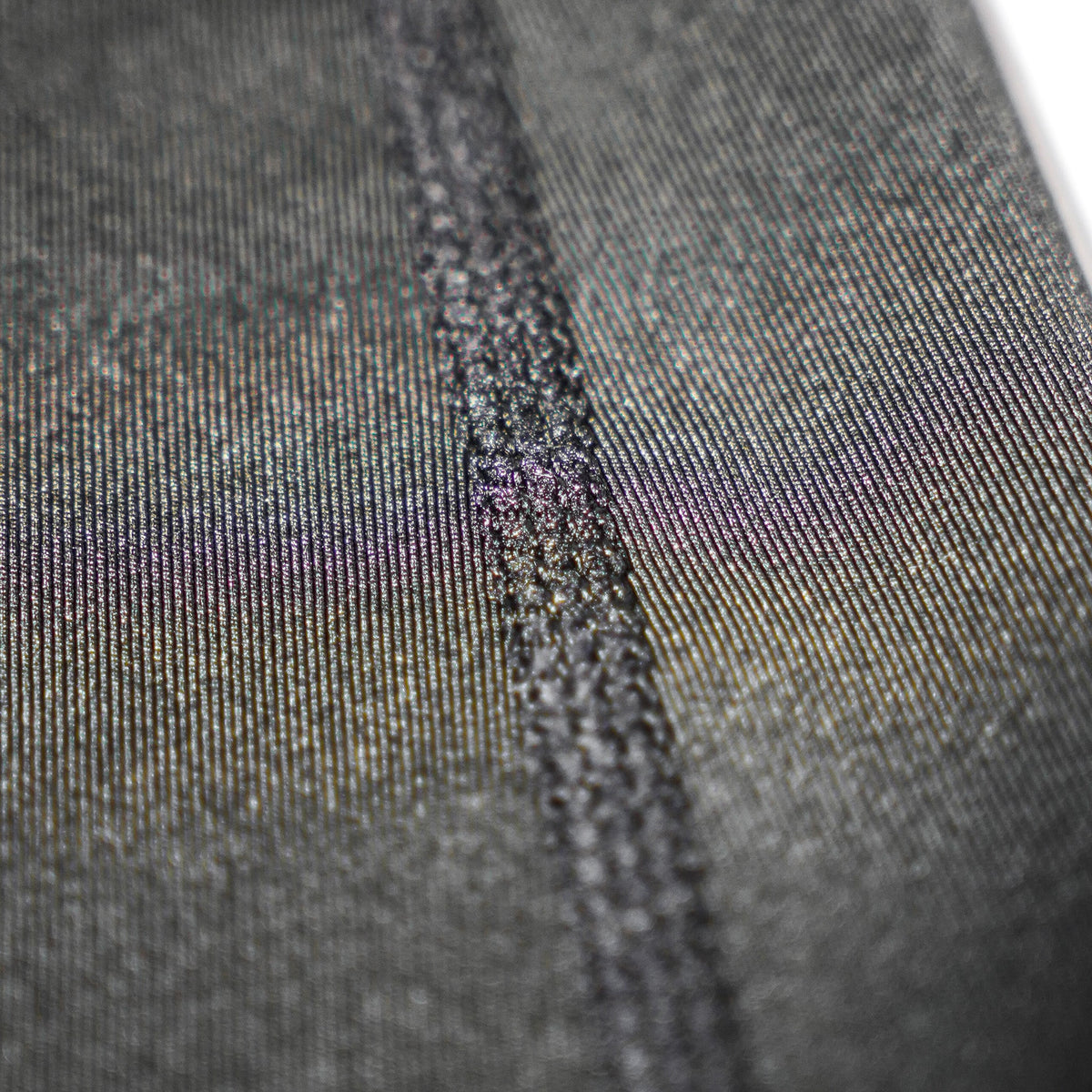 Macro shot of the compression fabric and seam on the OFFSET Competition Arm Sleeve