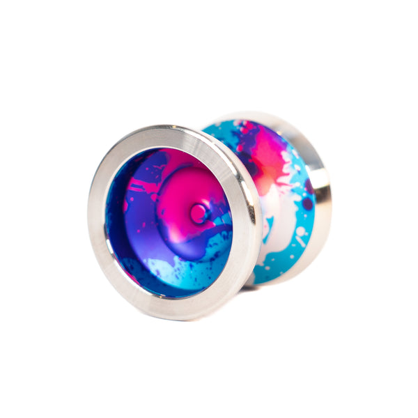 OUTLIER mini training yoyo in a pink and blue splash with steel rims